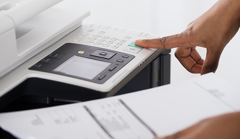 Top 5 benefits of mps for end users 830 person using printer
